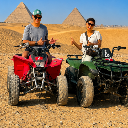 Tourist riding a quad bike in the desert with the Giza Pyramids in the background Quad bike adventure near the Great Pyramids of Giza, Egypt ATV tour through the desert surrounding the Giza Pyramids