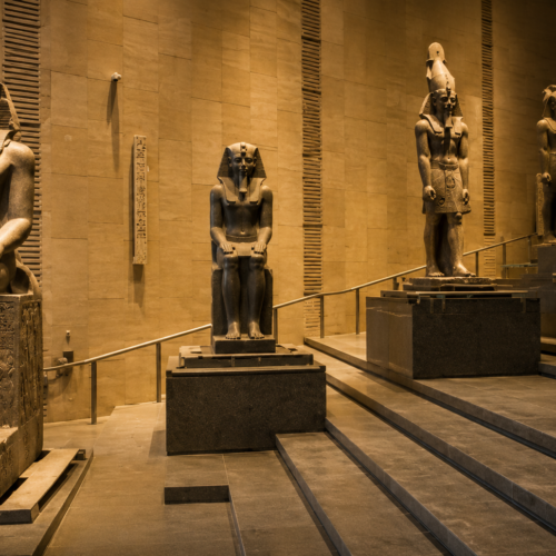 Grand Egyptian Museum in Giza with its modern architectural facade Exterior of the Grand Egyptian Museum near the Giza Pyramids Visitors exploring the Grand Egyptian Museum in Cairo, Egypt Grand Egyptian Museum entrance with the colossal Ramses II statue Ancient Egyptian artifacts displayed inside the Grand Egyptian Museum The Grand Staircase at the Grand Egyptian Museum in Giza Tutankhamun treasures exhibited at the Grand Egyptian Museum Panoramic view of the Grand Egyptian Museum overlooking the Giza Pyramids Modern interior gallery at the Grand Egyptian Museum in Egypt Tourists visiting the Grand Egyptian Museum during a guided Cairo tour Grand Egyptian Museum showcasing Egypt's ancient history and artifacts Grand Egyptian Museum illuminated at sunset in Giza, Egypt Interactive exhibits inside the Grand Egyptian Museum Family visiting the Grand Egyptian Museum near the Pyramids of Giza Grand Egyptian Museum featured on a private Cairo sightseeing tour