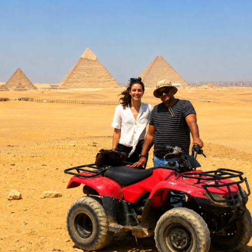 Tourist riding a quad bike in the desert with the Giza Pyramids in the background Quad bike adventure near the Great Pyramids of Giza, Egypt ATV tour through the desert surrounding the Giza Pyramids